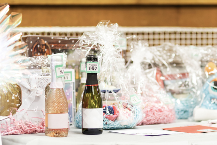 silent auction bid sheet example displayed next to auction item