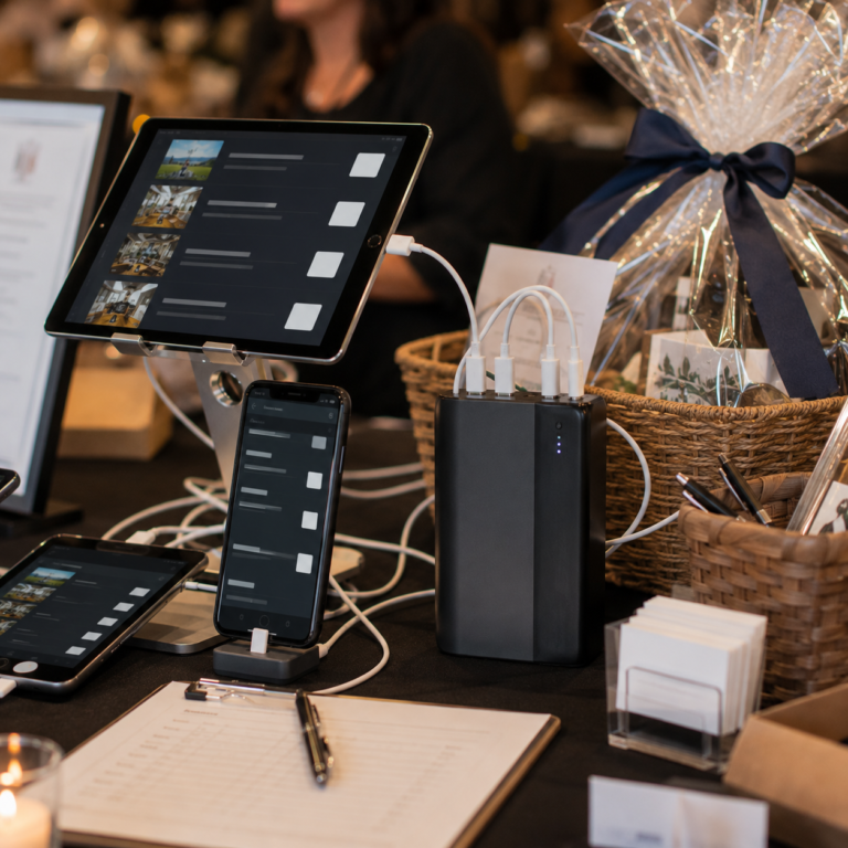 Portable charger powering devices at a nonprofit fundraising event